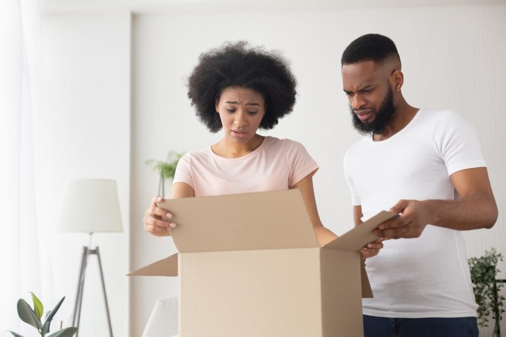 shocked upset african american couple got wrong purchase